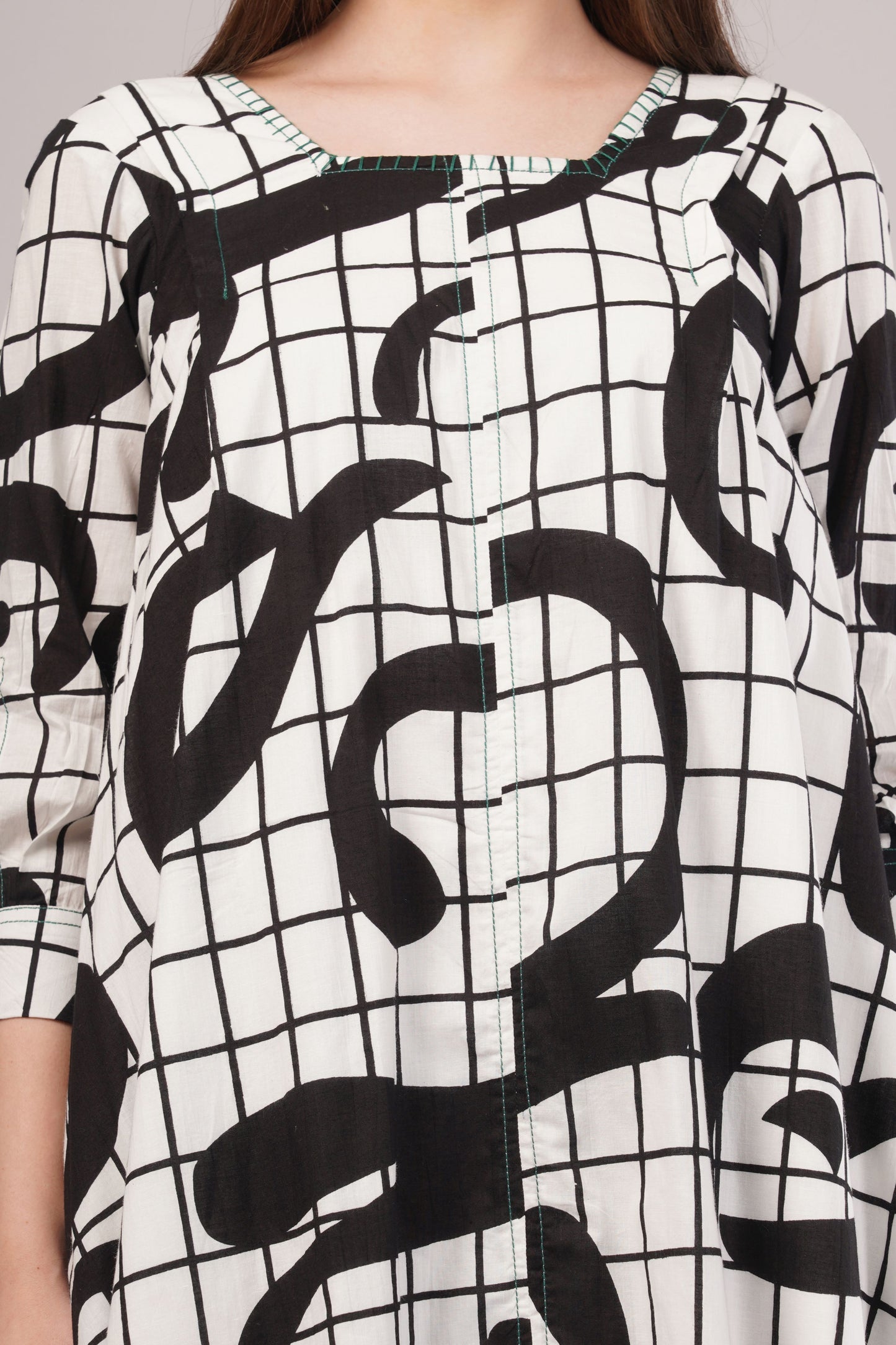 Monochrome Abstract Cotton Dress– Artistic Grid Print with High-Low Hem