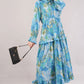 Tropical Blue Cotton Dress– Leafy Print with Bow Tie Neck & Tiered