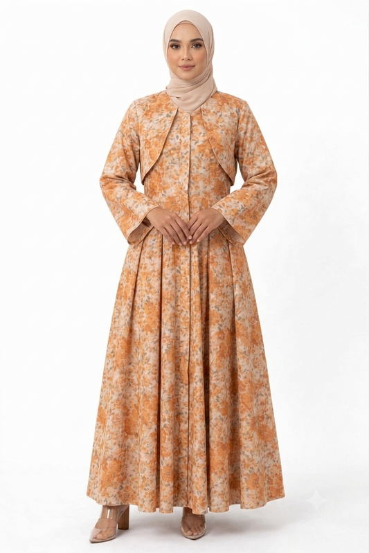 Woman wearing an orange floral dress with a matching hijab on a white background