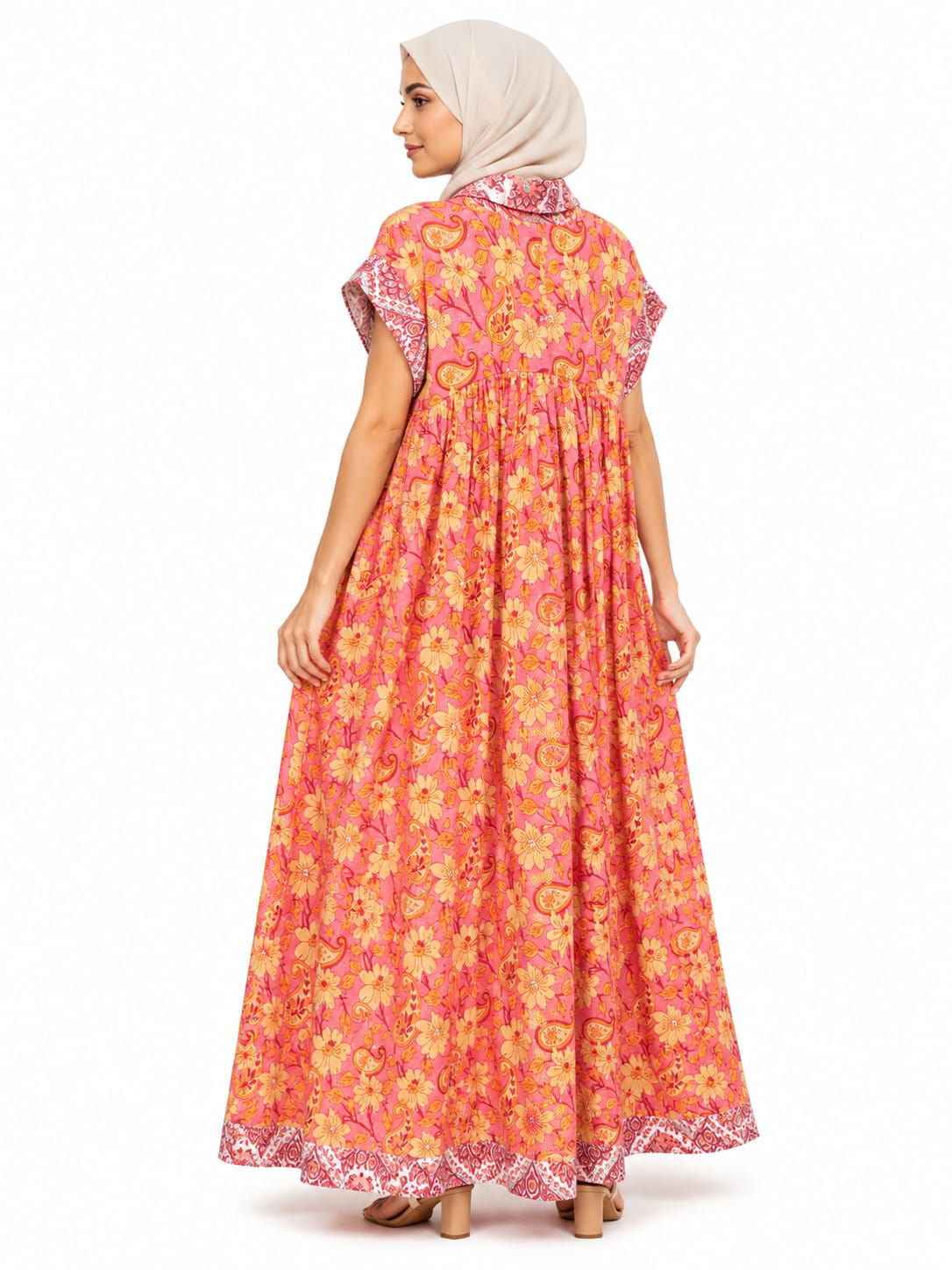 Woman wearing a floral dress on a white background