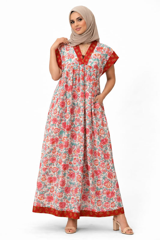 Woman wearing a floral dress with a plain background