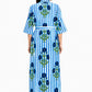 Woman wearing a blue and white striped dress with floral patterns on a white background