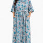 Woman wearing a floral dress on a white background