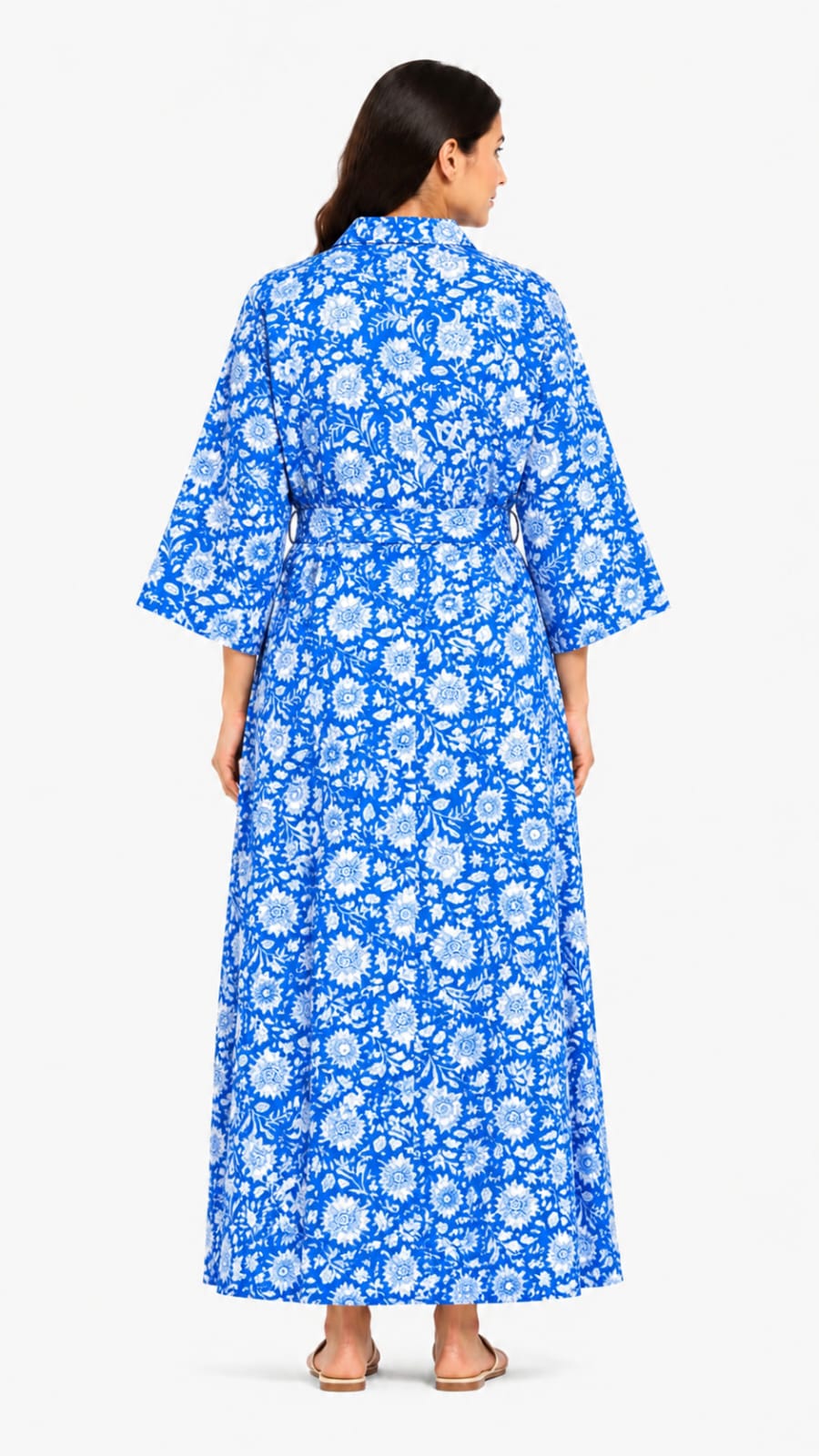 Woman wearing a blue floral dress on a white background