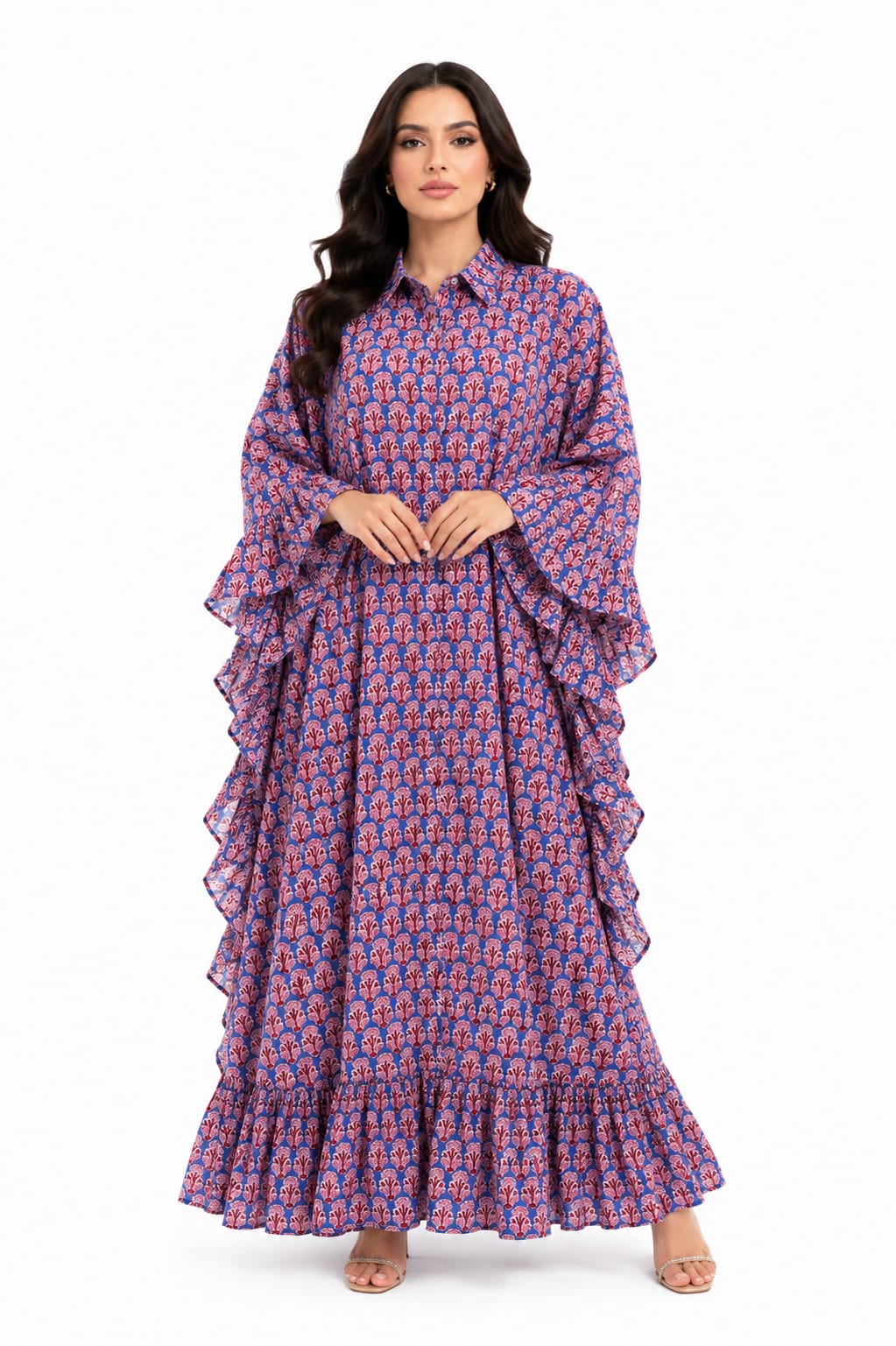 Front view of a model wearing a full length blue and red block print kaftan maxi dress featuring dramatic ruffle sleeves and a collared button down front