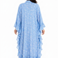 Woman wearing a blue layered dress with a white background