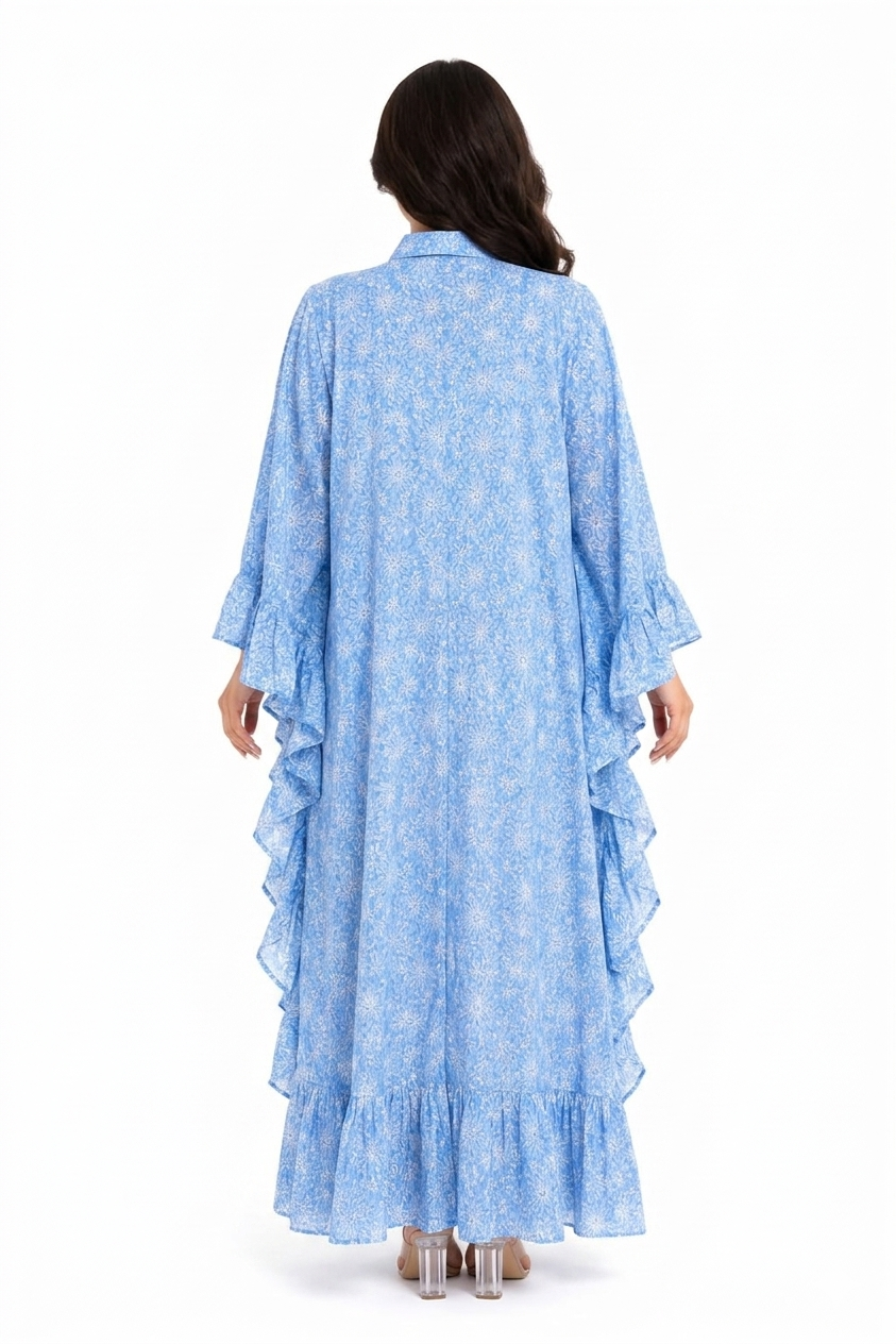 Woman wearing a blue layered dress with a white background