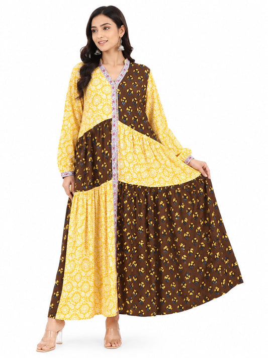 Woman wearing a yellow and brown patterned dress on a white background
